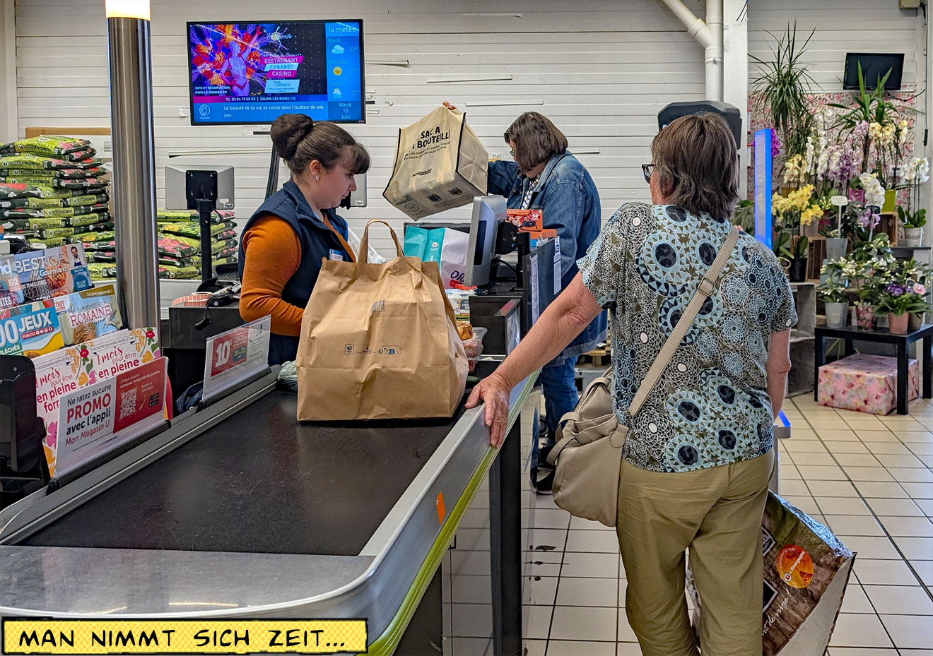 Im Supermarkt an der Kasse